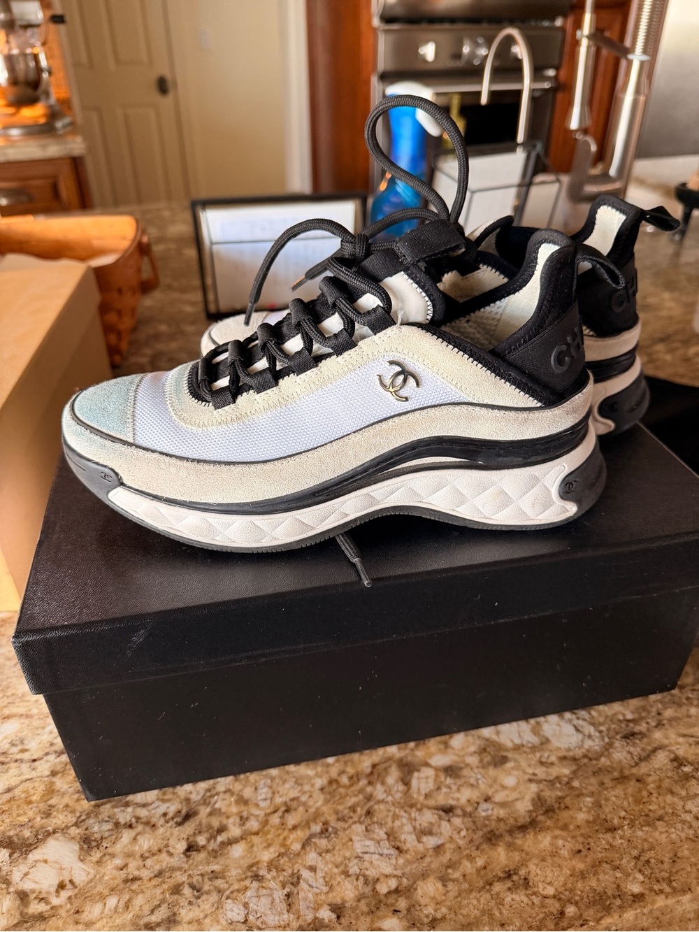 Chanel women’s Black & White Low-Top Sneakers